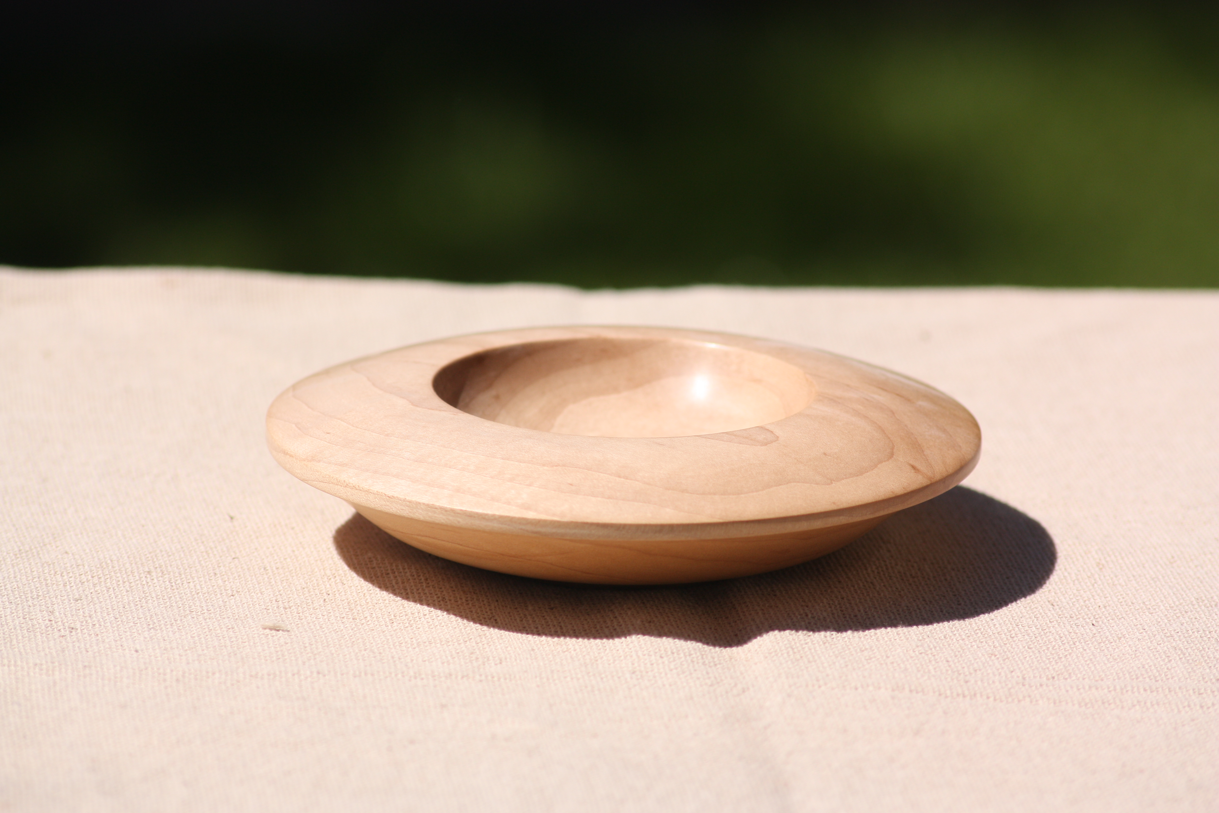 Side shot of Orbital style bowl showing undercut rim and Ogee base.